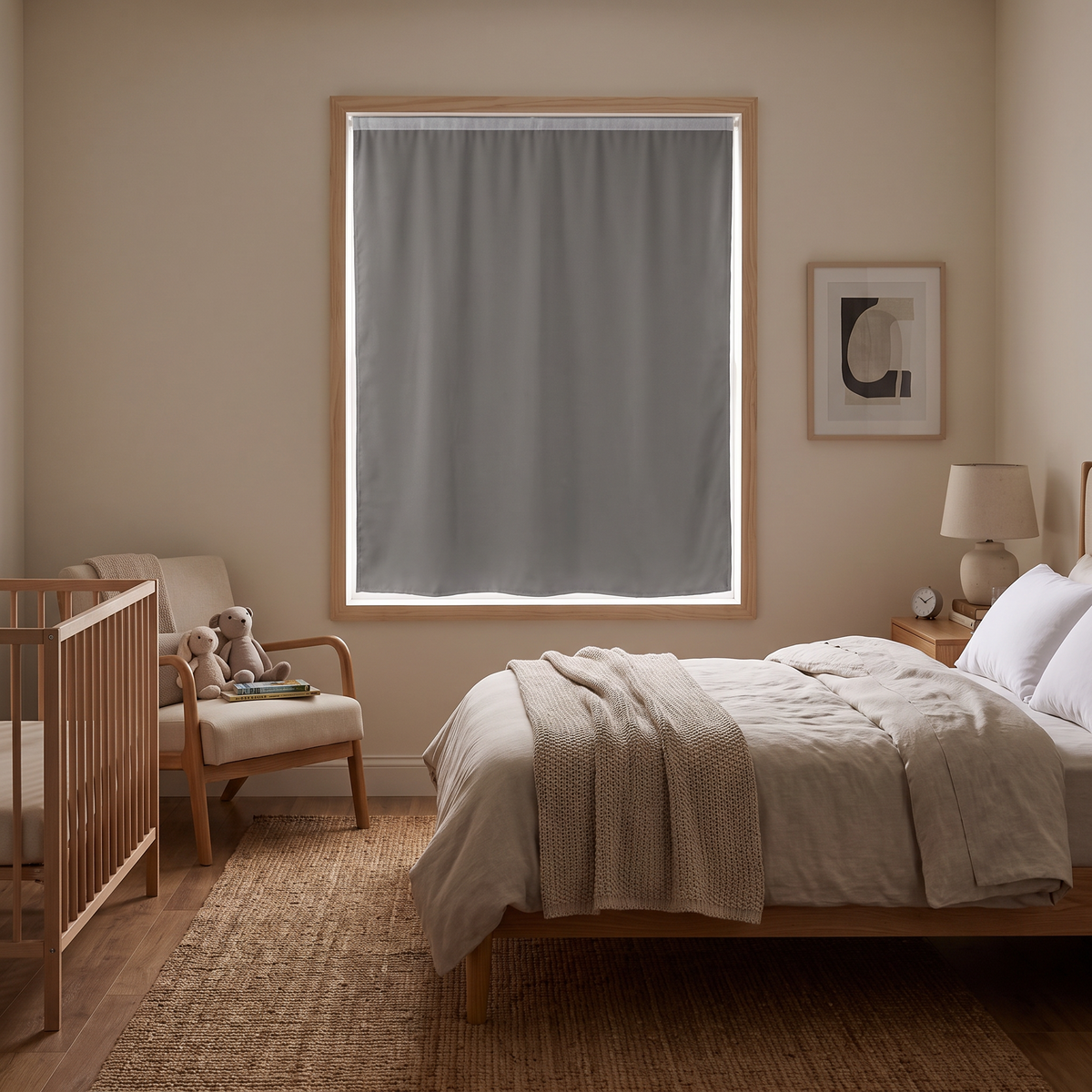 Gray blackout curtain darkening a nursery window